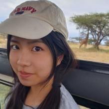 Student with black hair smiling