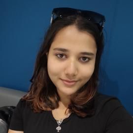 Student with black hair smiling