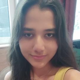Student with black hair smiling